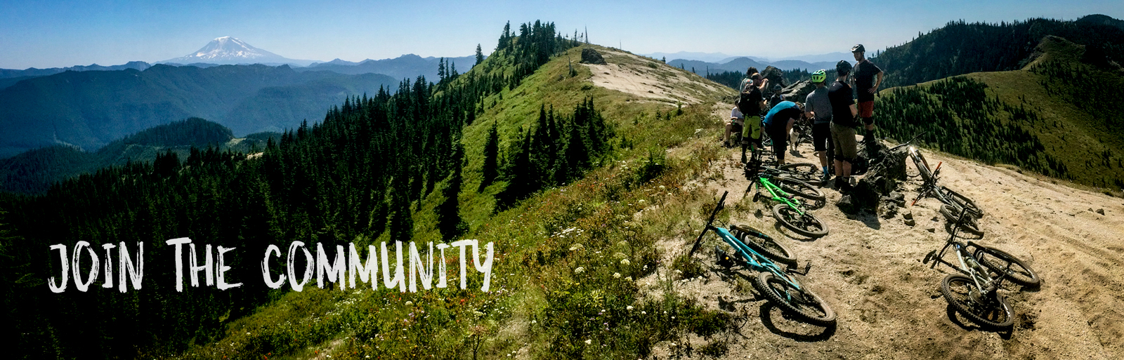 bikers resting on a ridge